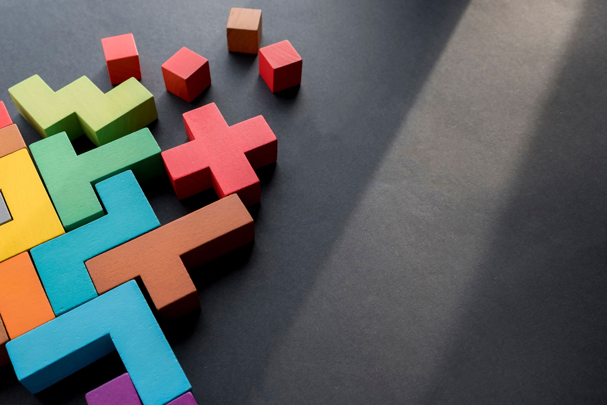 blocks with different shapes and colours fitting in each other